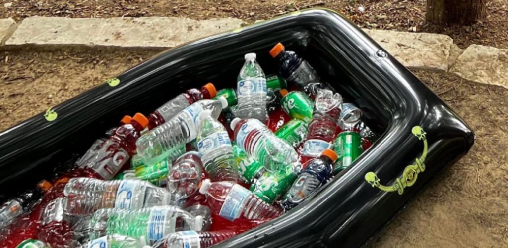 Inflatable coffin filled with drinks