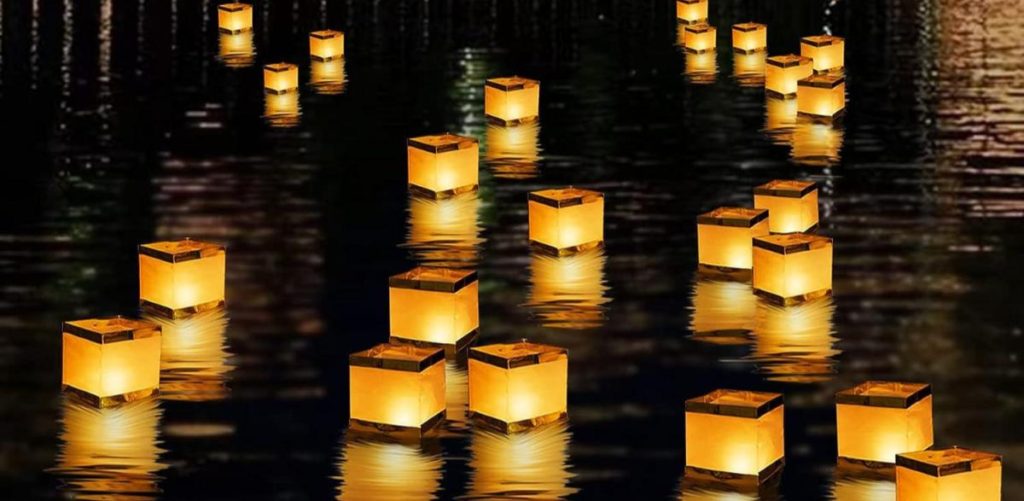 floating candles in a pool