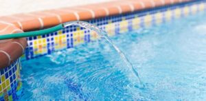 Using a hose to fill a pool with well water